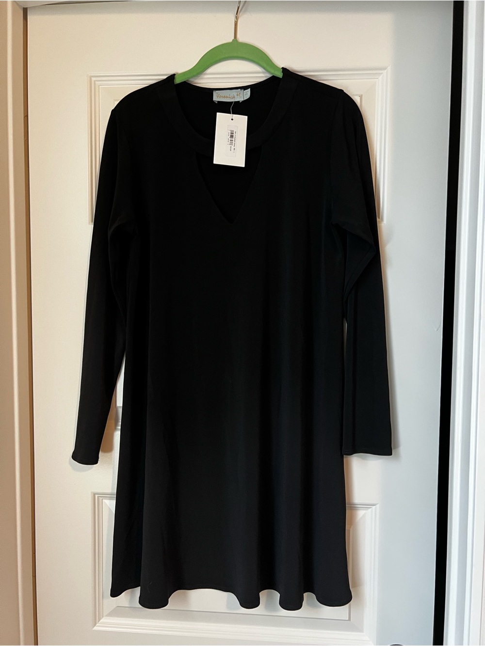 NWT Veronica M black long-sleeve shift dress with V-shaped cutout at the chest.
